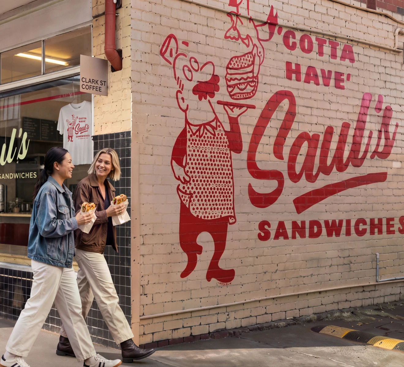Customers enjoying sandwiches outside Saul’s Sandwiches